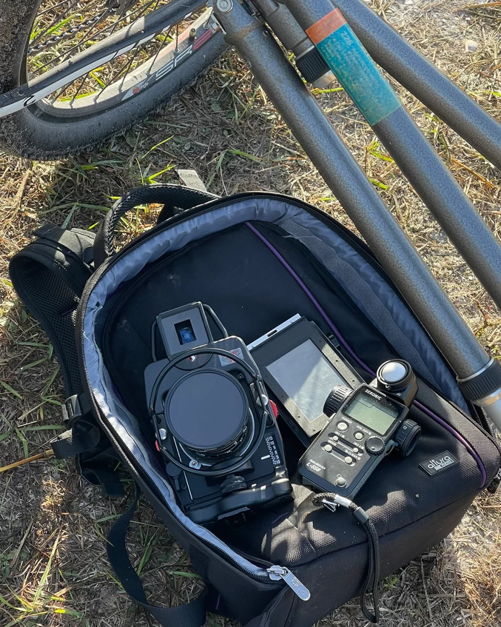 camera and accessories in backpack on ground during a photoshoot in Arthur Marshall Wildlife Preserve